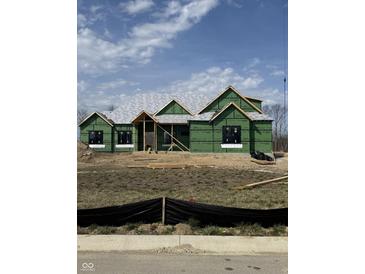 New construction home showcasing modern design with ZIP System sheathing and a partially completed roof at 2974 S Kings Way, New Palestine, IN 46163
