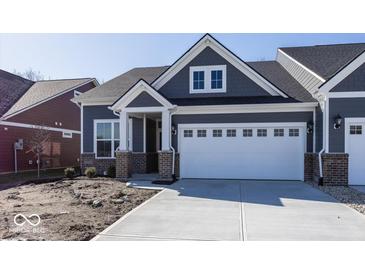 Charming home featuring a two-car garage, stylish gray siding, and a welcoming front porch at 3917 Holly Brook Dr, Westfield, IN 46062