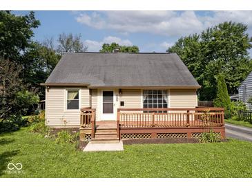 Charming single-story home featuring a cozy front deck and a well-maintained lawn at 6348 Kingsley Dr, Indianapolis, IN 46220