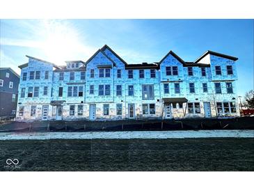 New construction townhomes show modern design and large windows for ample natural light at 7356 W County Road 600 Rd # 12-606, McCordsville, IN 46055