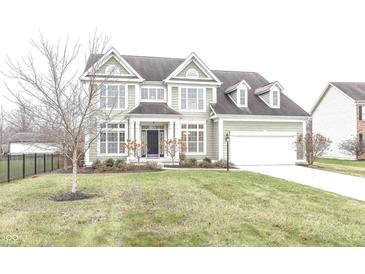 Two-story house with a green exterior, white trim, and a large front yard at 11323 Long Sotton Ln, Fishers, IN 46037