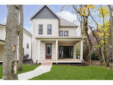 Two-story craftsman home with covered porch and landscaped lawn at 1818 Central Ave, Indianapolis, IN 46202