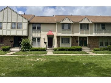 Charming townhomes with well-maintained lawns and unique architectural details for inviting curb appeal at 8021 E 20Th St, Indianapolis, IN 46219