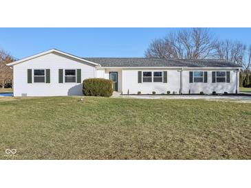 White ranch house with green shutters, landscaping, and a spacious lawn at 901 N 700 W, Greenfield, IN 46140