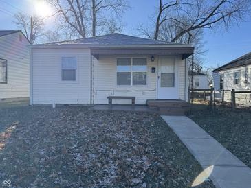 Cute bungalow with a covered porch, steps, and small front yard at 3305 E 30Th St, Indianapolis, IN 46218
