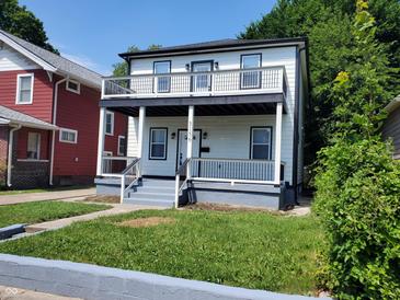 Two-story house with white siding, black accents, and a front porch at 3156 Graceland Ave, Indianapolis, IN 46208