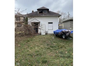 White house with a gabled roof and yard at 2364 Shelby St, Indianapolis, IN 46203