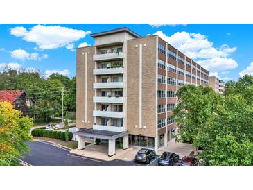 Modern multi-story building with ample parking and landscaping at 3965 N Meridian St # Apt 6C, Indianapolis, IN 46208