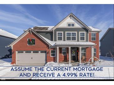 Two-story brick home with gray siding, snow covered front yard, and attached garage at 4223 Mardale Ln, Bargersville, IN 46106