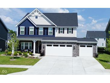 Beautiful two-story home with a two-car garage and manicured lawn at 19243 Foley Dr, Westfield, IN 46074