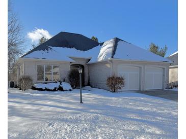 Brick ranch home with snow-covered lawn and attached two-car garage at 1238 Passage Way, Plainfield, IN 46168