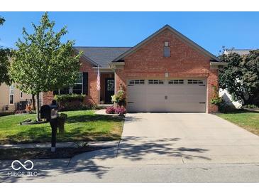 Brick ranch home with 2-car garage, landscaping, and a mailbox at 13952 Avalon Blvd, Fishers, IN 46037