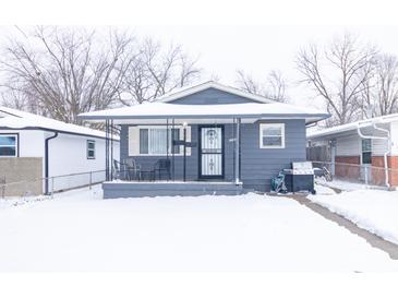 Gray house with snow covered lawn at 1704 Nelson Ave, Indianapolis, IN 46203