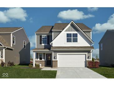 Charming two-story home with gray siding, a two-car garage, and a well-manicured front lawn at 11620 Hartwell St, Indianapolis, IN 46235