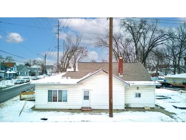 Rear view of house, snow covered yard at 1363 & 1367 S Belmont Ave, Indianapolis, IN 46221