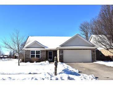 Brick ranch home with snow covered roof and lawn at 4624 Hogan Cir, Plainfield, IN 46168