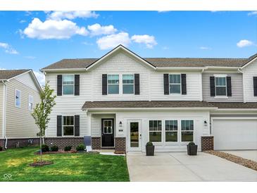 Charming two-story home featuring black shutters and a well-manicured lawn at 18632 Walsh Way, Westfield, IN 46074