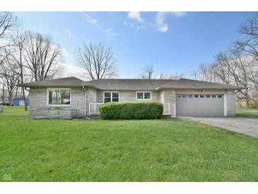 Charming single-story home with stone details and a well-manicured lawn at 67 W Brookville Rd, Fountaintown, IN 46130