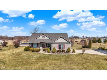 Charming single-Gathering home with manicured lawn, brick facade, and a welcoming entrance at 10194 E 900 N, Markleville, IN 46056