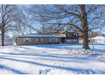 Ranch style home with a spacious yard, perfect for entertaining at 10725 E County Road 650 N, Indianapolis, IN 46234