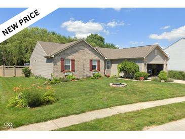 Charming single-story home with a well-manicured front yard and delightful curb appeal, featuring flower-filled window boxes at 6540 Avalon Blvd, Avon, IN 46123
