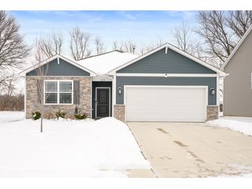 Newly built home with gray siding, stone accents, and a two-car garage at 829 Stark St, Greenfield, IN 46140