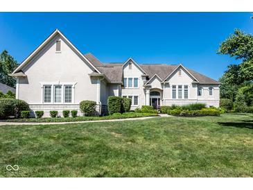 Large two-story house with light-colored brick and landscaping at 8526 Oakmont Ln, Indianapolis, IN 46260