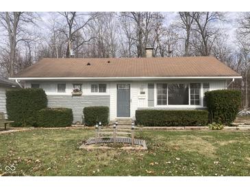 Charming ranch home with gray siding, landscaping, and a small bridge at 2610 W 18Th St, Anderson, IN 46011