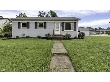 Ranch style home with gray exterior, landscaped lawn, and walkway at 5201 N White Ln, Lawrence, IN 46226