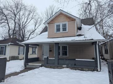Two-story house with snow-covered front yard at 3050 N Gladstone Ave, Indianapolis, IN 46218