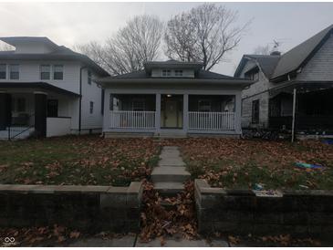 Cozy bungalow with front porch, situated on a tree-lined street at 3608 N Kenwood Ave, Indianapolis, IN 46208