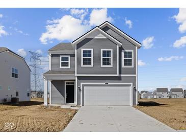 Two-story home featuring gray siding, white trim, and an attached two-car garage at 5144 Rolling Meadow Blvd, Indianapolis, IN 46237