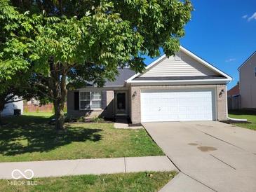 Brick ranch home with attached garage and landscaped lawn at 1129 Half Moon Ln, Cicero, IN 46034