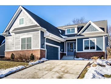 Inviting two-story home featuring a brick foundation, beautiful siding and a paved driveway at 20188 Hampton Park Dr, Westfield, IN 46074