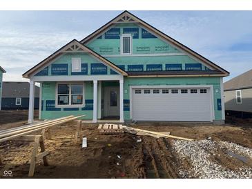 New construction one-story home featuring a two-car garage and a covered front porch in a residential community at 5860 Handbell Ln, Greenwood, IN 46143