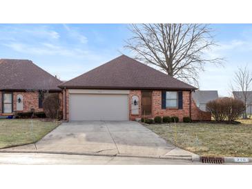 Brick ranch home with attached garage and landscaped yard at 710 Eagle Pkwy # 15, Brownsburg, IN 46112