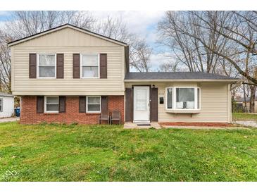 Brick and beige two-story house with a well-maintained lawn at 8224 Barry Rd, Indianapolis, IN 46219