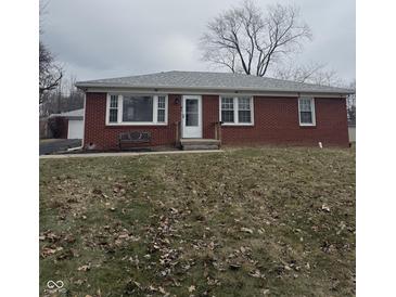 Brick ranch house with a spacious yard at 1215 N Shortridge Rd, Indianapolis, IN 46219