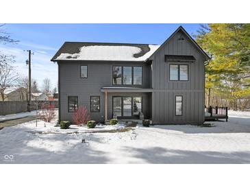 Two-story modern farmhouse with gray siding, large windows, and a covered deck at 2248 W Us Hwy 40, Greenfield, IN 46140