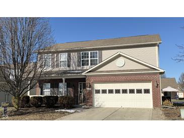 Two-story brick home with attached garage and landscaping at 10652 Brighton Knoll N Pkwy, Noblesville, IN 46060