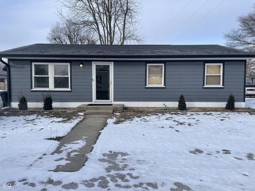 Charming ranch home with gray siding, landscaping, and snow-covered lawn at 1360 S Cherry St, Martinsville, IN 46151