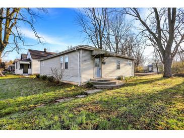 Charming single-story home with a well-maintained yard and classic architectural details at 2319 N Rural St, Indianapolis, IN 46218