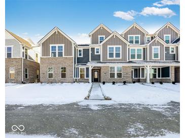 Attractive 3-story townhome with gray siding and stone accents at 5755 Cr W 750 N, McCordsville, IN 46055