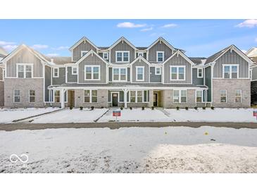 Gray three-story townhouses with snowy front yards at 5767 Cr W 750 N, McCordsville, IN 46055