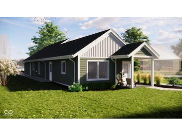 Green house exterior with covered porch and landscaping at 4521 Norwaldo Ave, Indianapolis, IN 46205