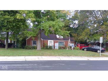 Brick ranch house with a yard and driveway at 915 Raible Ave, Anderson, IN 46011