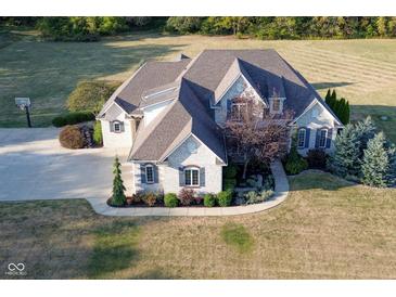 Brick house with 3-car garage, large yard, and basketball court at 10100 Sanctuary Dr, Brownsburg, IN 46112