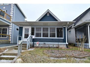 Charming single-story home with a front porch and inviting curb appeal at 1719 Fletcher Ave, Indianapolis, IN 46203