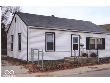 White house with black window frames and a chain link fence at 3726/3722/3716 N Emerson Ave, Indianapolis, IN 46218