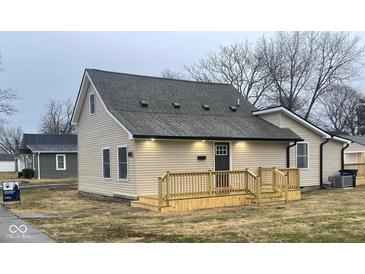 Beige house with new deck and landscaping at 633 S 17Th St, Elwood, IN 46036